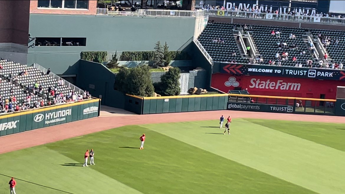 Sponsor advertising inventory on the outfield fence and scoreboard structure at Truist Park (photographed 2023)