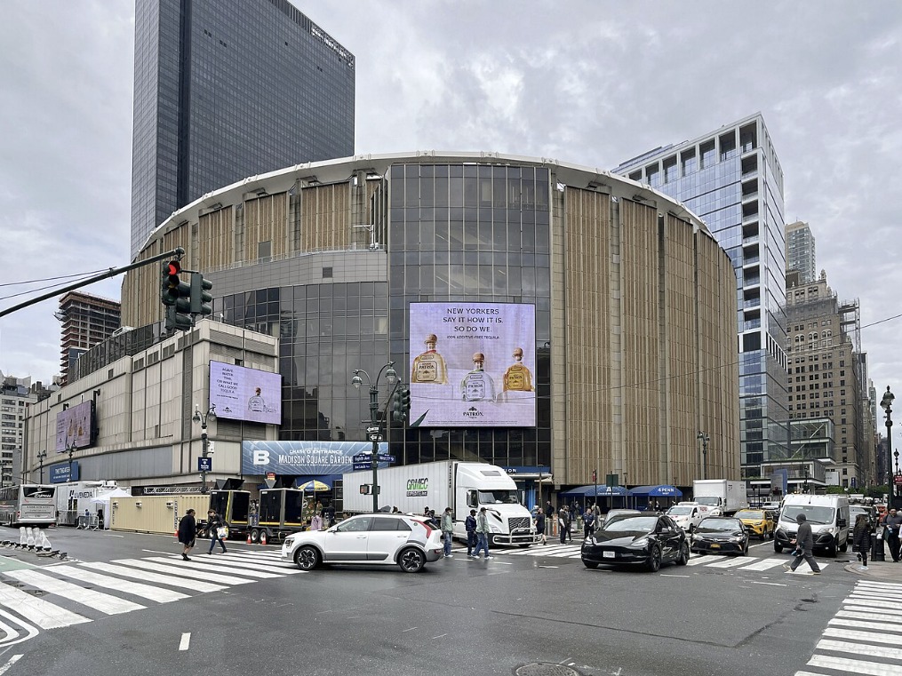 Madison Square Garden exterior seen from 8th Avenue, with digital screens around the circular facade