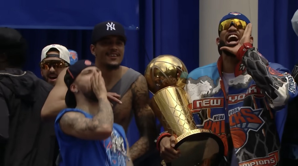 Knicks players celebrating with the Larry O'Brien Trophy, June 2026