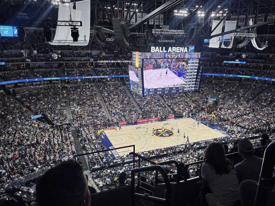 View from the upper level of a packed Ball Arena looking down on a Nuggets playoff game