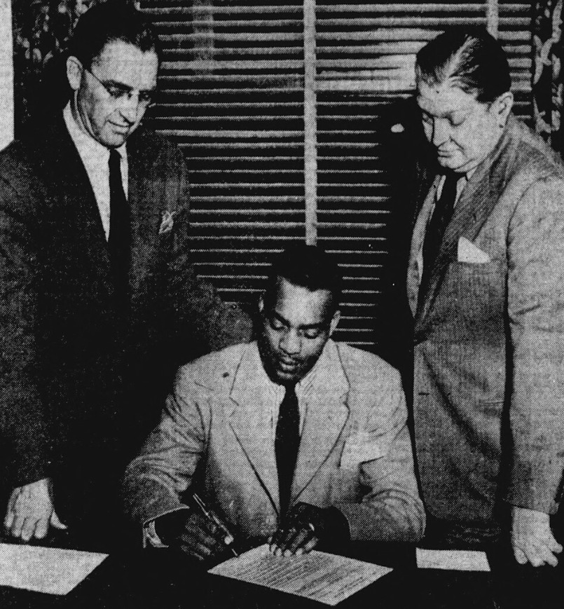 Kenny Washington signing his contract with the Rams, March 21, 1946