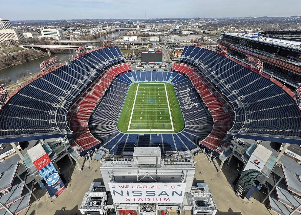 Aerial view of Nissan Stadium in Nashville, with the new stadium rising at the upper right