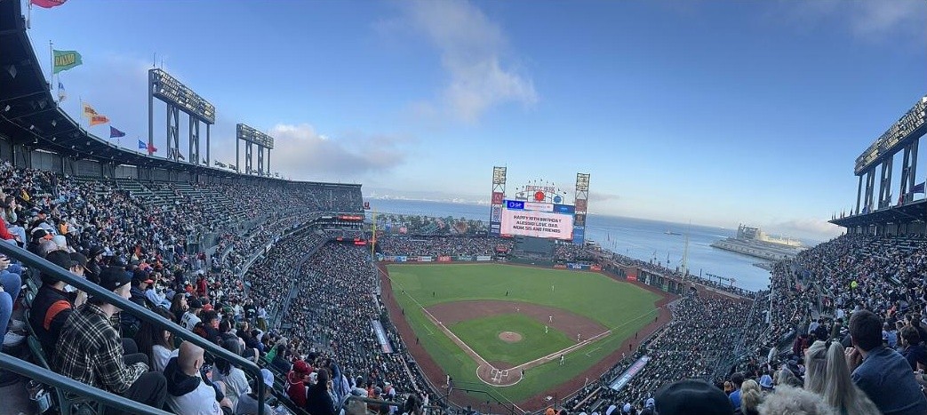 View of Oracle Park from the stands, with San Francisco Bay stretching out beyond the outfield