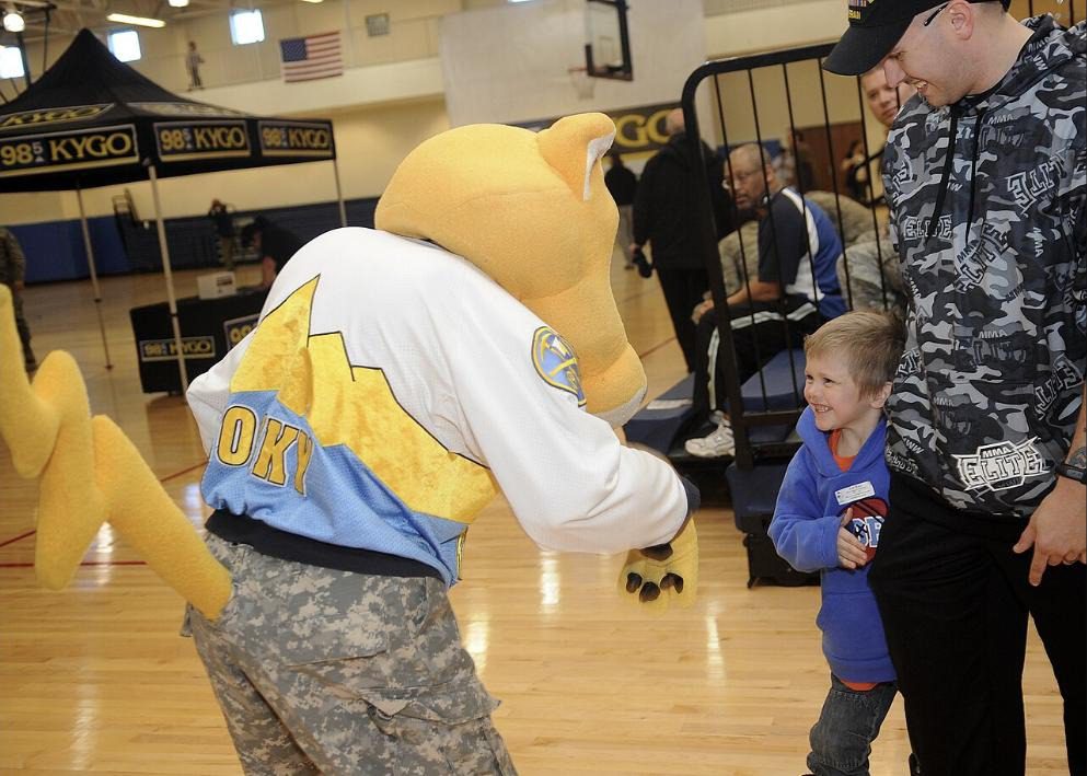 Rocky, the Nuggets mascot, greeting a child at a military family event