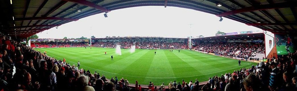 Panoramic view of the stands wrapped by low roofs at Vitality Stadium during a 2013 match against Blackpool
